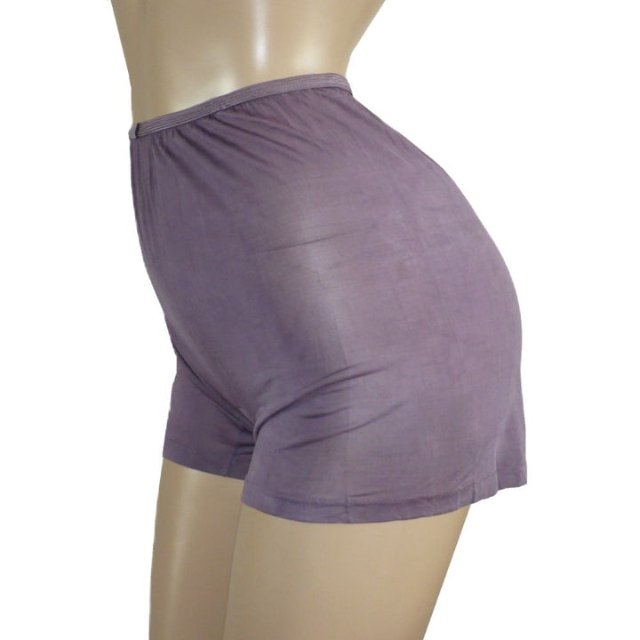 Purple shorts on a mannequin against a white background