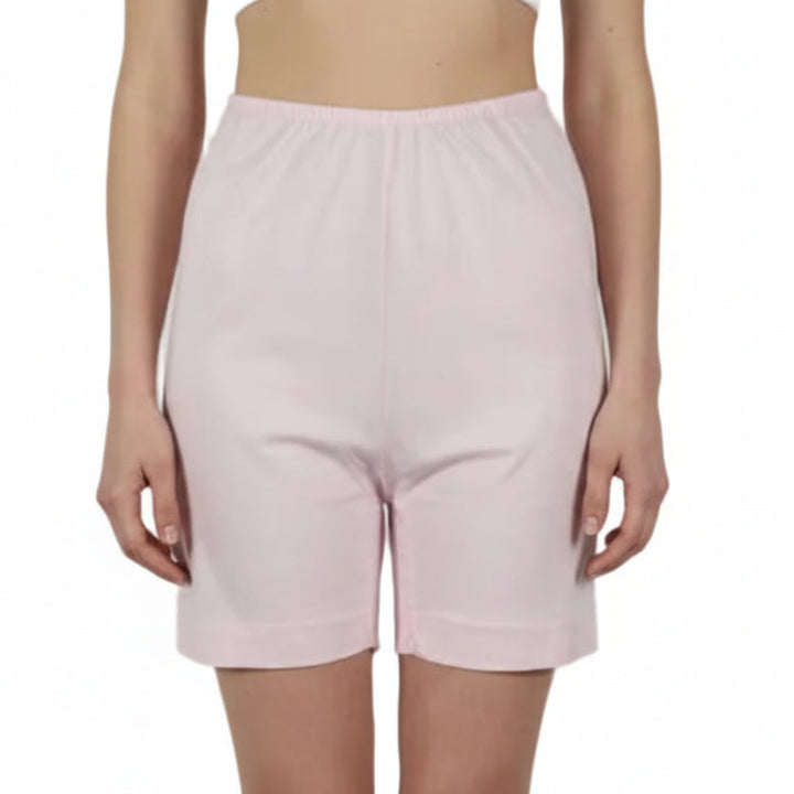 Pink shorts on a mannequin against a white background