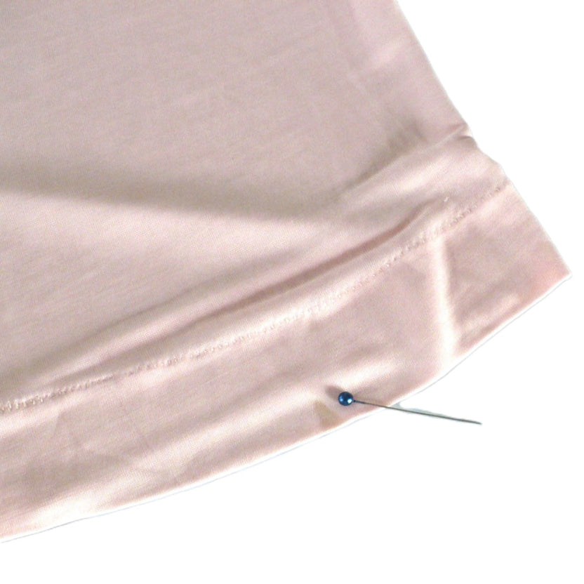 1960s Vintage Tall Treat Pink Rayon Long Leg Panties with head of pin next to stain at banded leg.