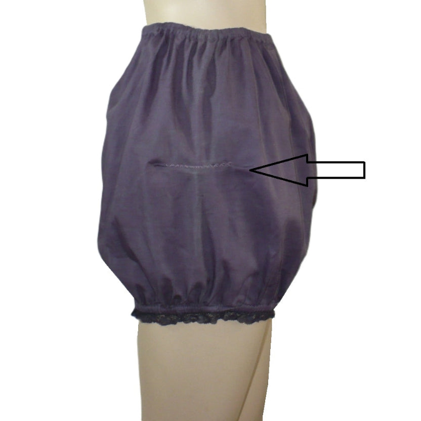 Purple bloomers on a mannequin with an arrow pointing to a specific area.