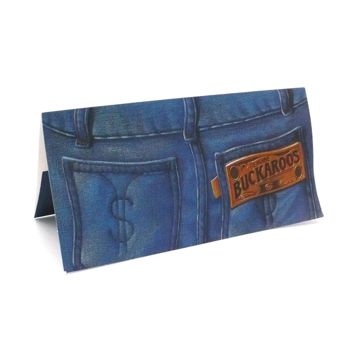 Vintage 1970s Hallmark birthday money holder by Dick Varney. The illustration depicts the back of blue jeans with a stitched dollar sign on the pocket and a faux-leather patch reading "Genuine Buckaroos."