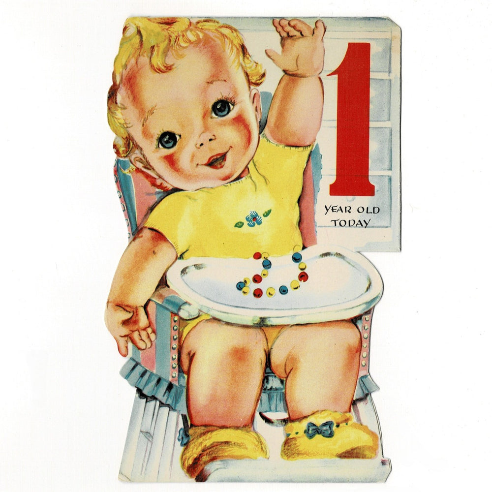 The illustration is a quintessential mid-century "storybook" style. It shows a rosy-cheeked toddler with blonde curls sitting in a white highchair, viewed from behind as they reach a hand toward a wall shelf. The highchair is accented with a blue-and-red striped back cushion and a ruffled blue skirt at the base. The die-cut edges follow the silhouette of the baby and the chair, creating a custom shaped feel when closed.