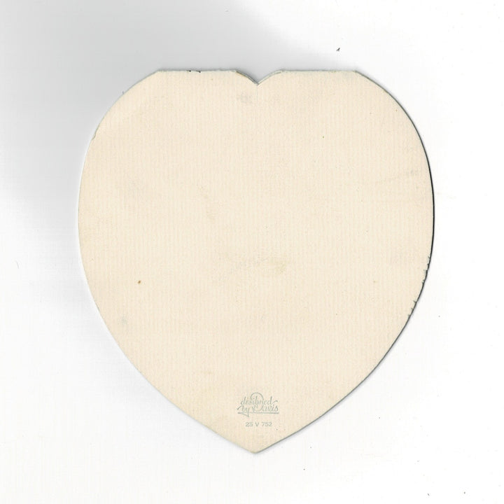 This elegant heart-shaped vintage Valentine’s Day card features a sophisticated construction where the sentiment is printed on a separate interior sleeve. The card follows a romantic Edwardian revival theme, with a real pink satin ribbon bow on the front that binds the interior sleeve to the die-cut outer shell. back side.