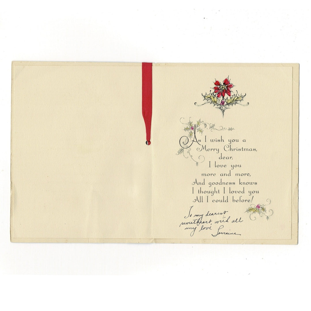 The text is printed in a classic, refined serif typeface with a decorative flourished initial A. This specific card is hand-signed in blue ink with a deeply personal holiday message, adding to its authentic mid-century character.