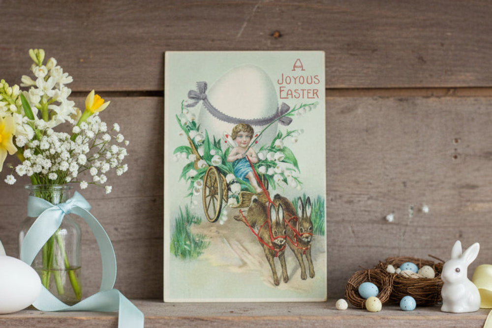 Antique, vintage Easter postcard shown on shelf as unique, seasonal holiday display.