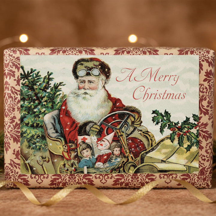 1910 Santa & Toys In A Roadster Car Vintage Christmas Postcard, shown as a gift topper.