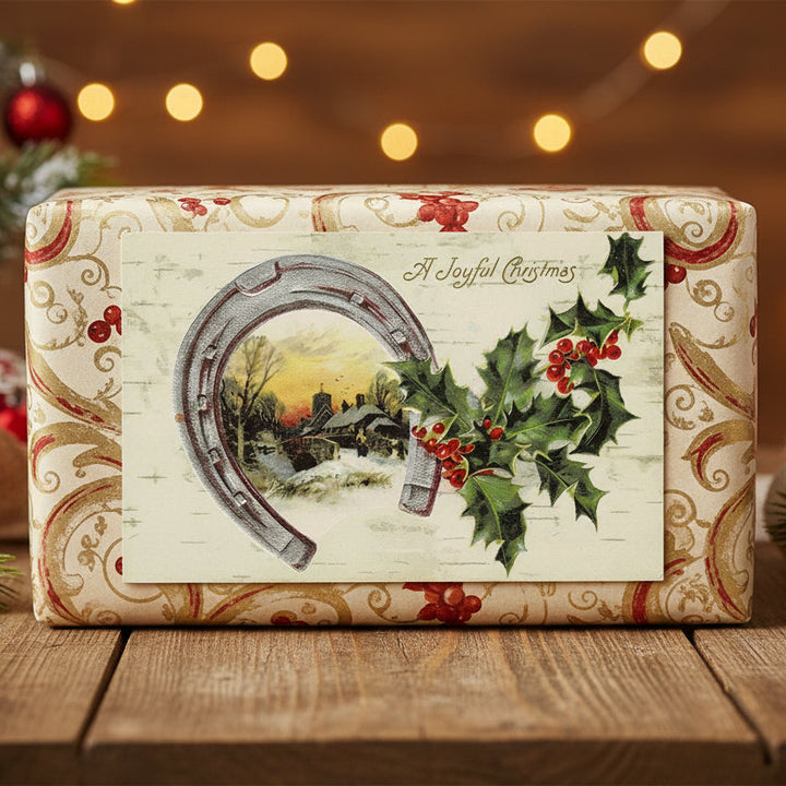 Good Luck & Good Fortune Holly & Horseshoe Vintage Christmas Postcard, shown as a gift topper.