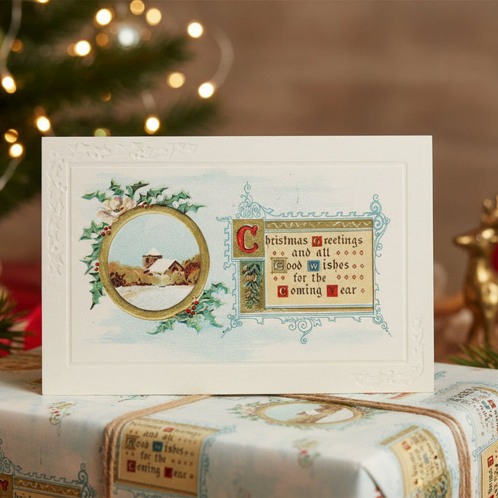 1914 First Christmas of WW1 New Year Vintage Postcard on a wrapped present with festive background.