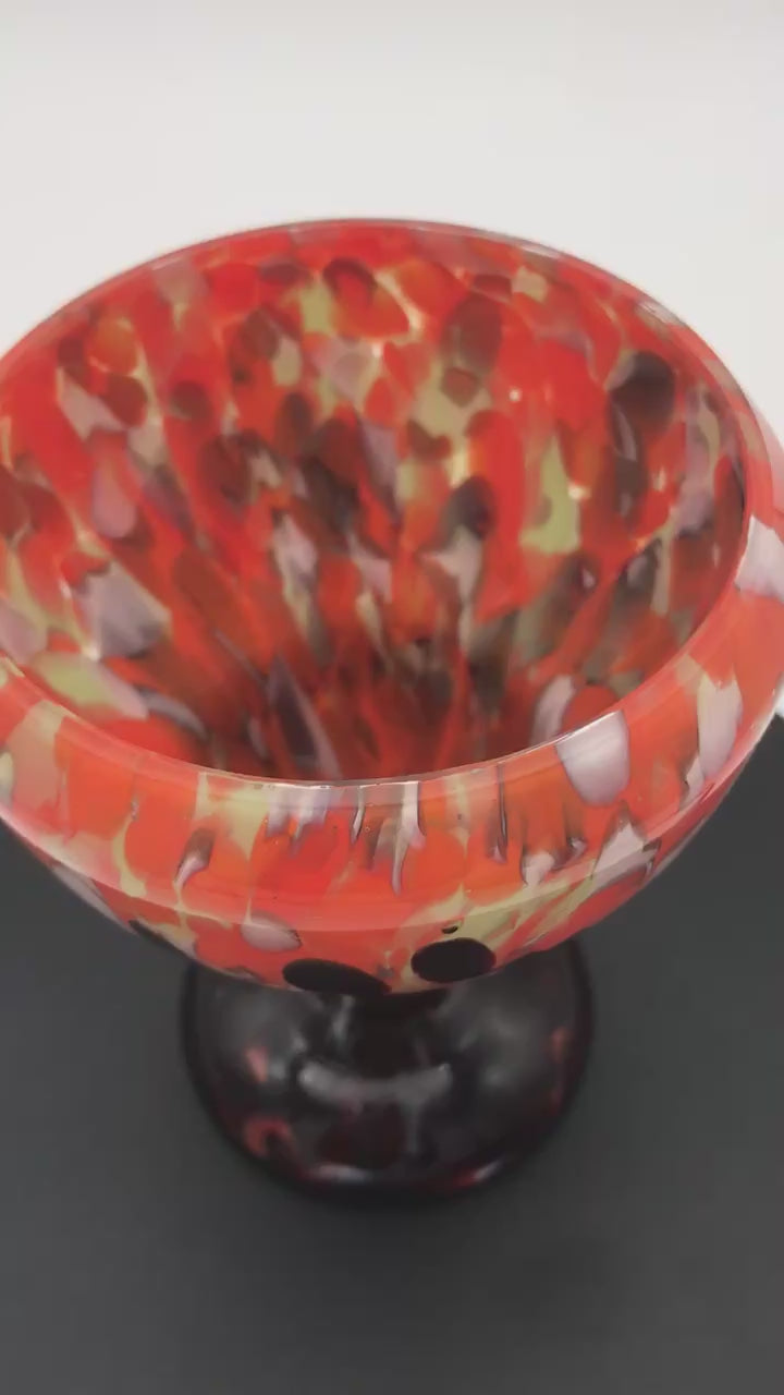 1930 Bohemian Spatter Cabinet Vase, attr. to Steinwald, rotating on a spinning platform.