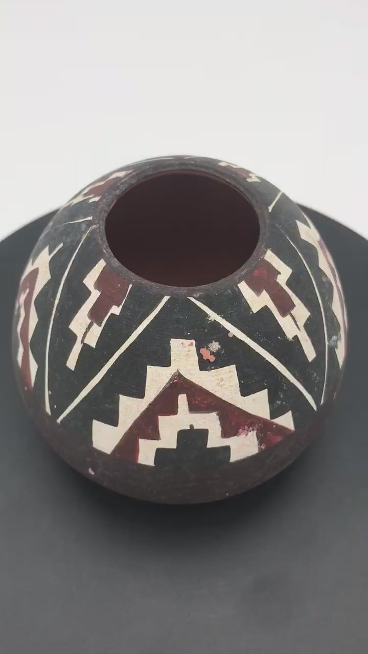 Mid-Century Diaguita Style Ceramic Seed Pot, Handcrafted South American Tribal Pottery, view of pot on a moving platform.
