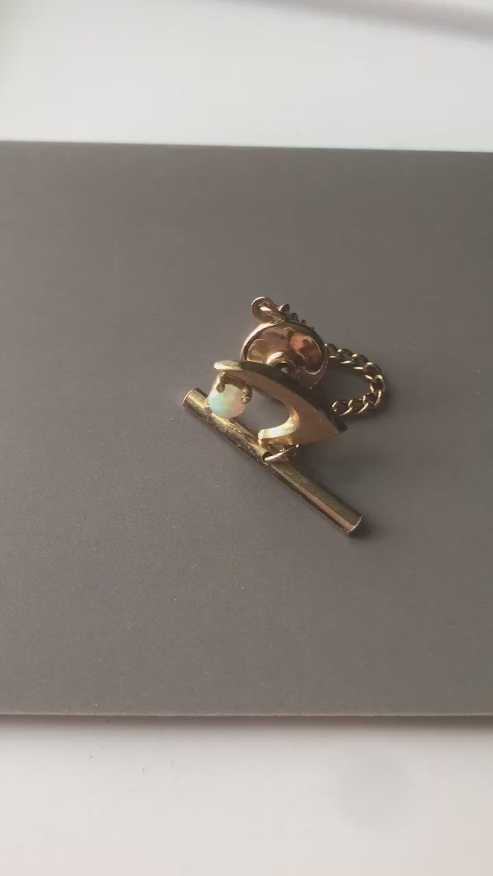 Video of tie tack that shows the fire in the opal better than able to capture in still images.